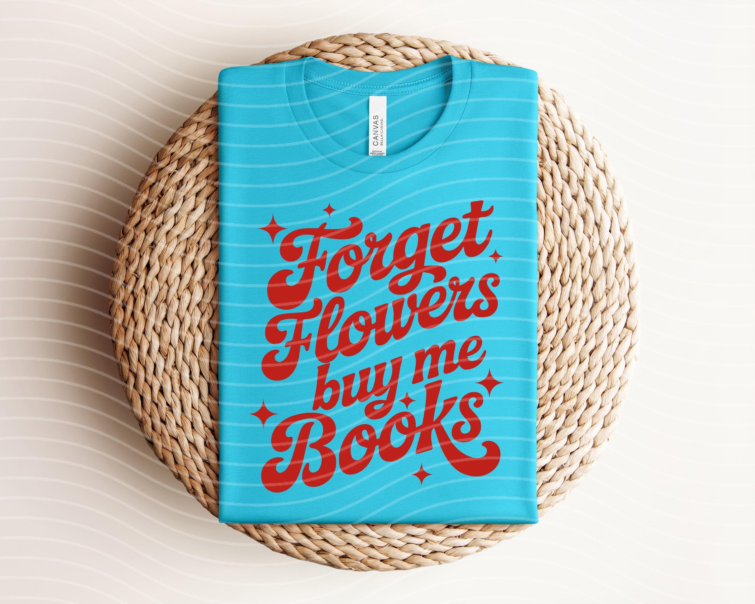 Black graphic tee from Anchored Grace Boutique featuring "Forget Flowers, Buy Me Books" design, casual and stylish for book lovers.