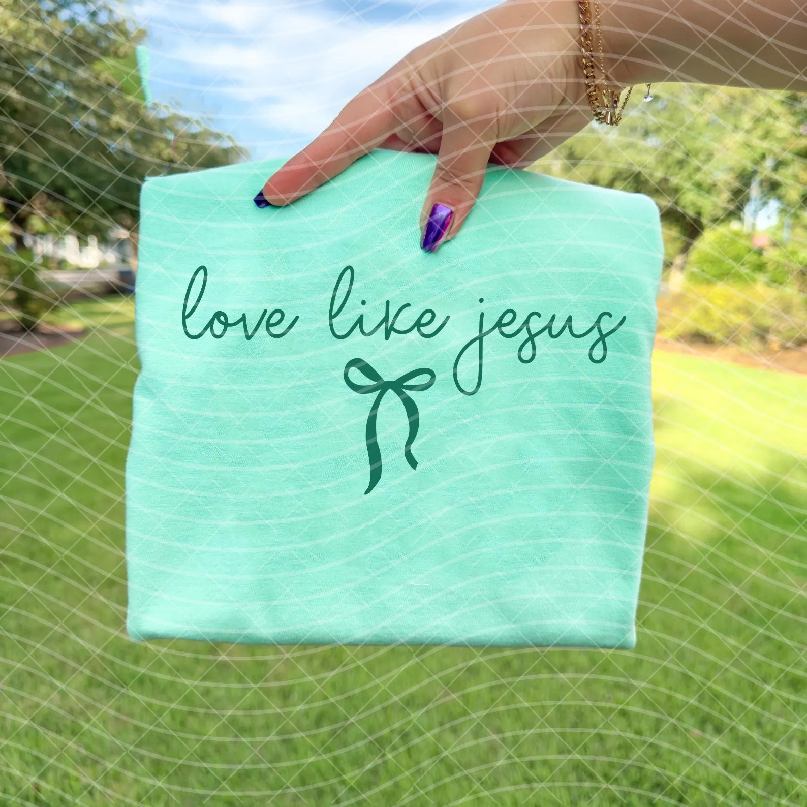 Love Like Jesus graphic tee from Anchored Grace Boutique featuring a stylish Christian-themed design on a casual t-shirt.
