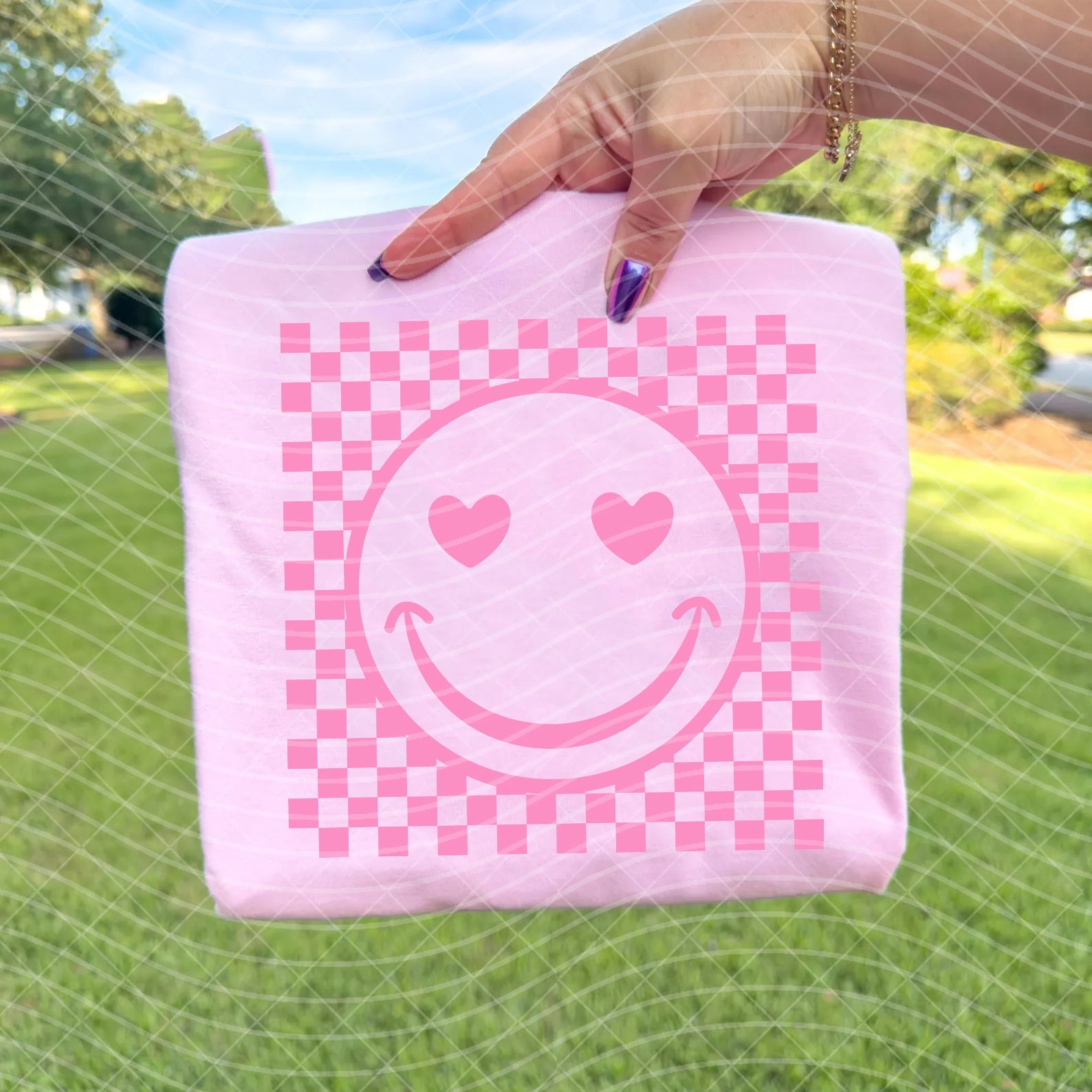 Love Smiley graphic tee by Anchored Grace Boutique featuring a cheerful smiley face design on a casual t-shirt.