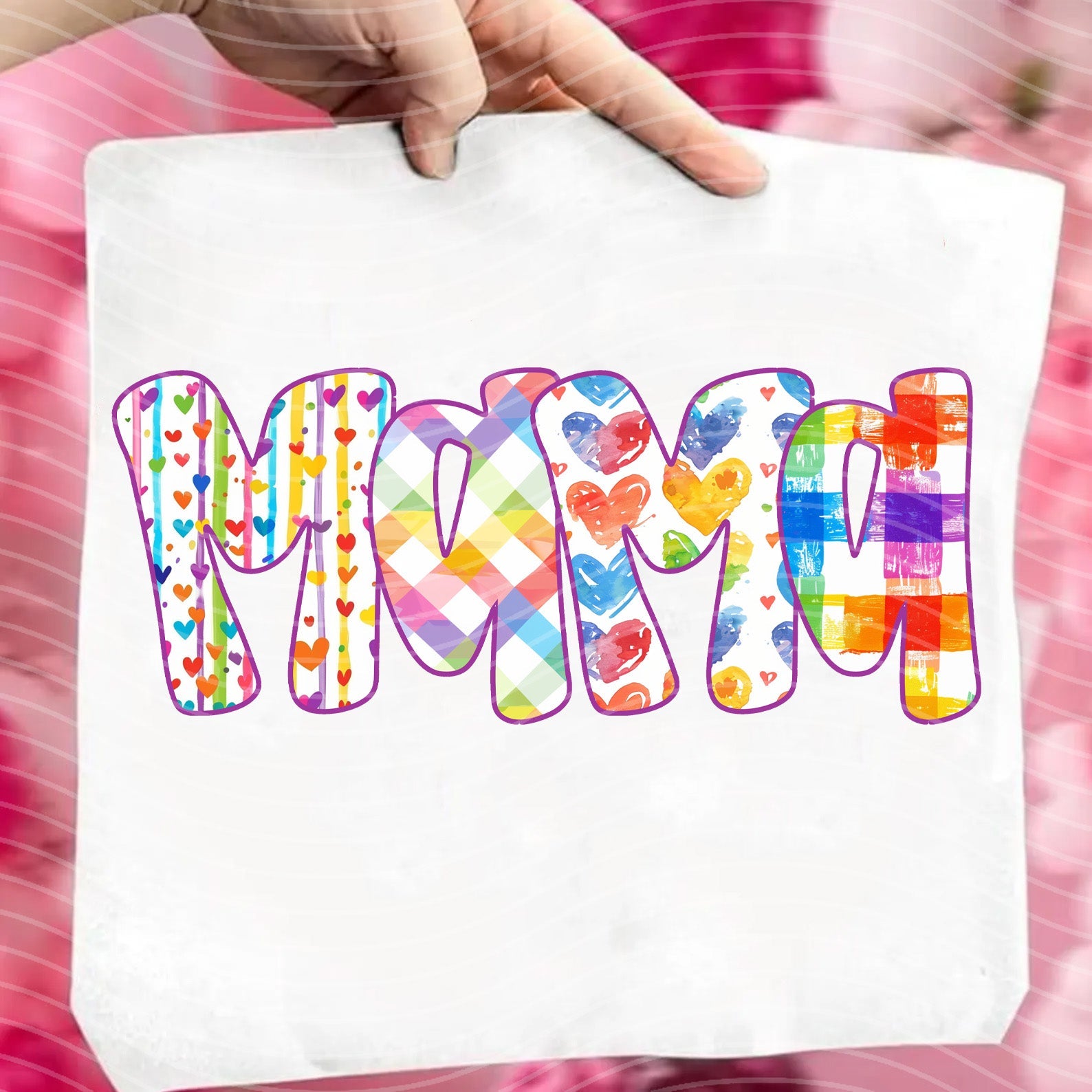 Mama Rainbow graphic tee by Anchored Grace Boutique, showing a colorful rainbow design and the text "Mama Rainbow" on soft fabric.