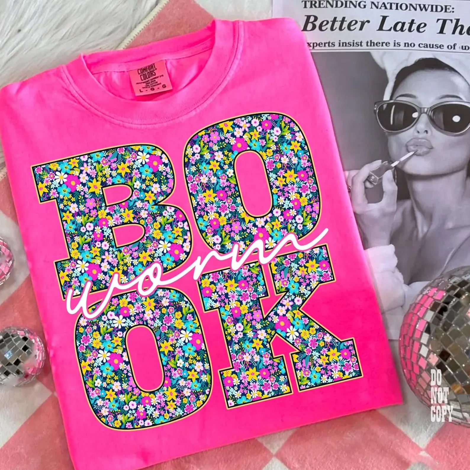 Black Book Worm graphic tee by Anchored Grace Boutique featuring a playful worm illustration and casual fit.