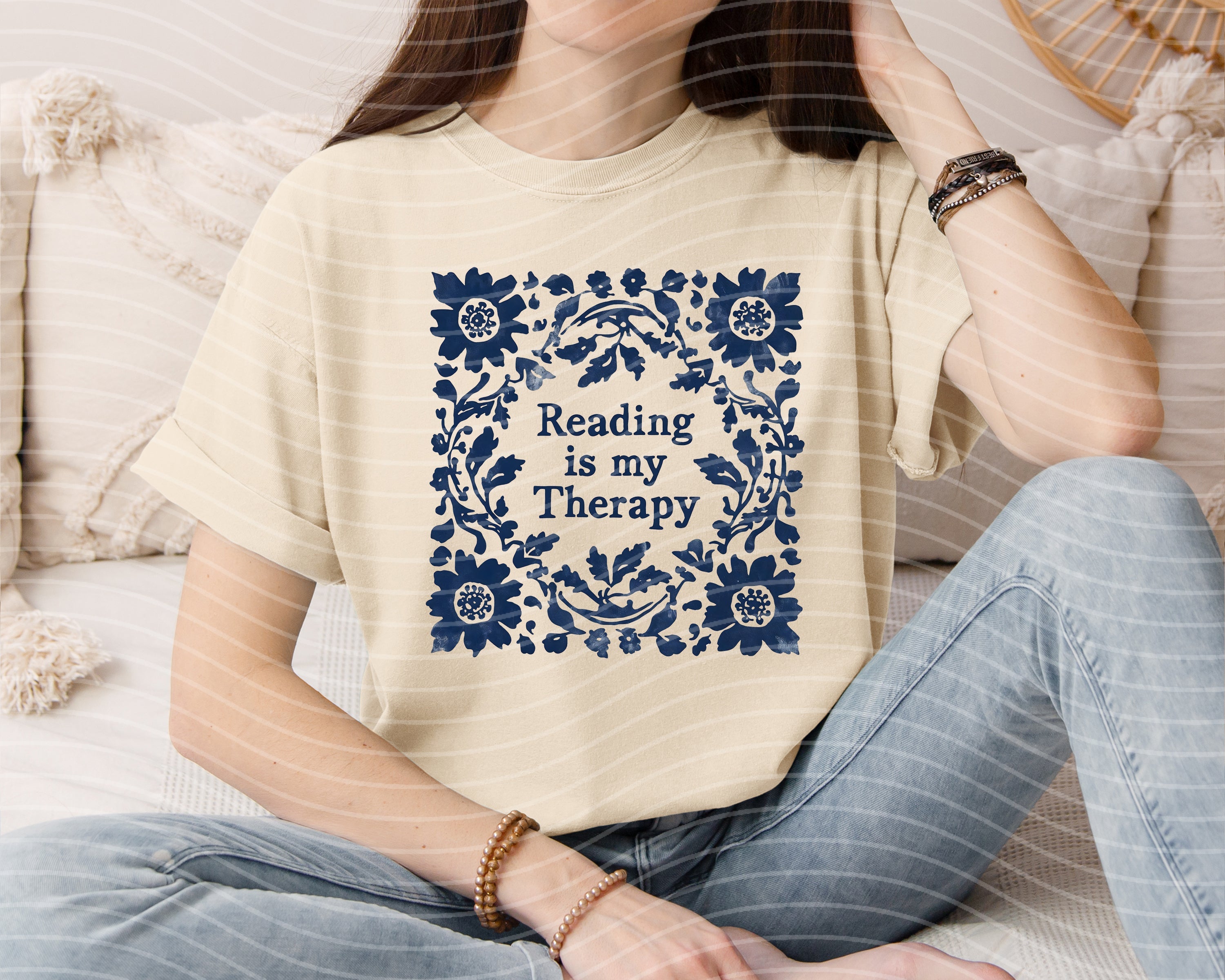 Black graphic tee from Anchored Grace Boutique featuring the phrase "Reading is My Therapy" in stylish white lettering.