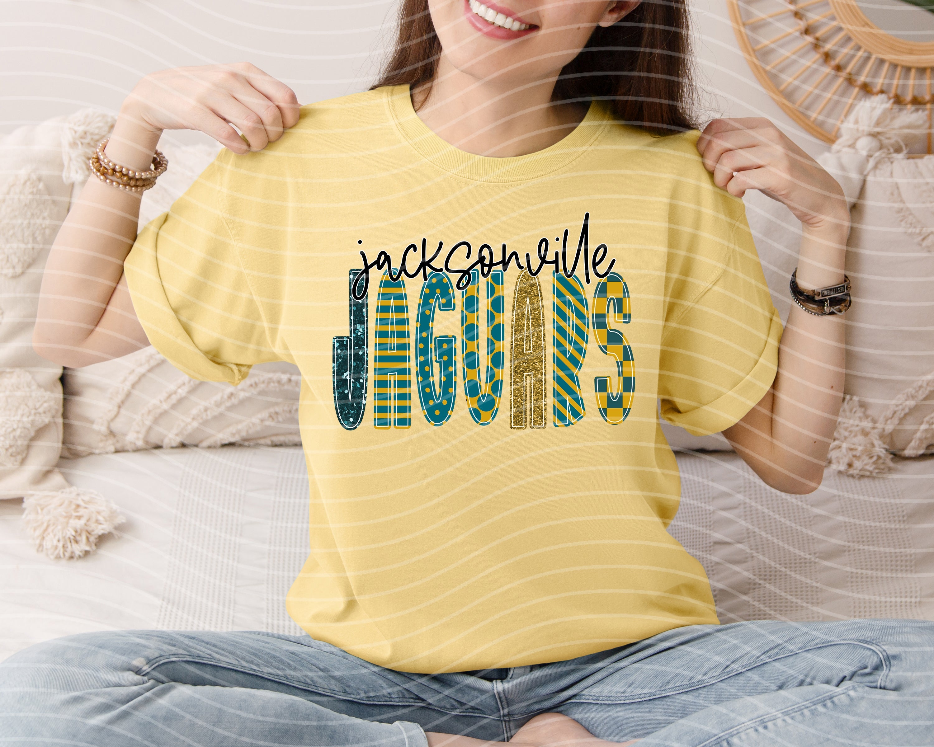 Anchored Grace Boutique Jaguars Doodle Font graphic tee showcasing a stylish, casual design with playful text and vibrant colors.