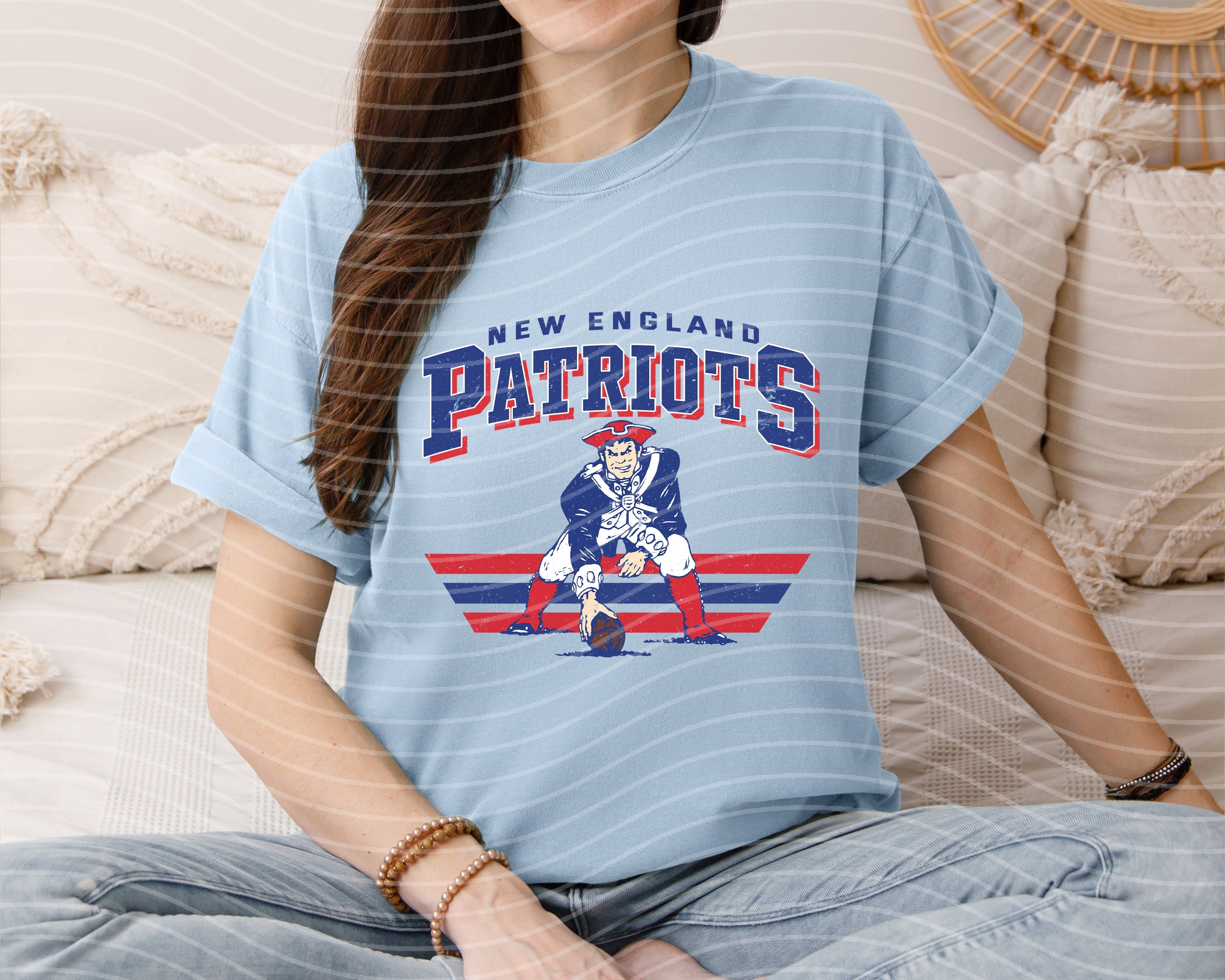 Vintage Patriots graphic tee by Anchored Grace Boutique featuring team logo and retro style, casual unisex t-shirt.