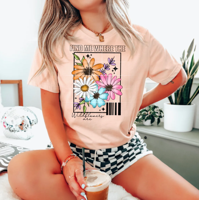 Find Me Where the Wildflowers Are graphic tee by Anchored Grace Boutique, featuring a floral-inspired design on a casual t-shirt.