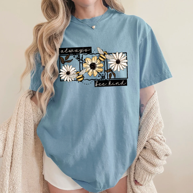 Always Bee Kind graphic tee by Anchored Grace Boutique, featuring a colorful bee design on a casual cotton t-shirt.