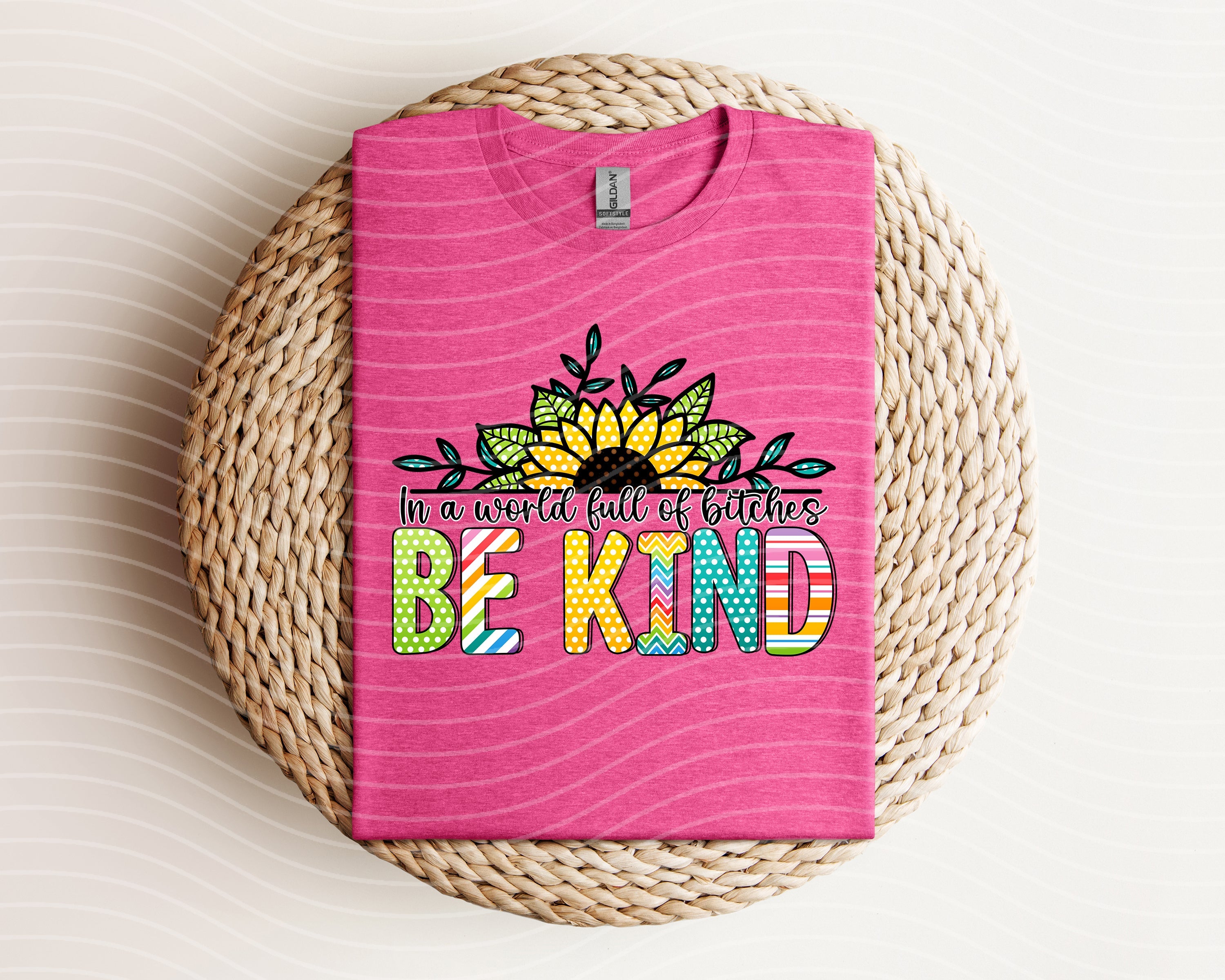 Black graphic tee from Anchored Grace Boutique featuring bold white text that reads "In a World Full of B****es Be Kind."