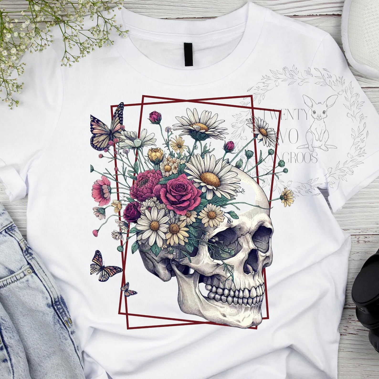 Floral skull graphic tee by Anchored Grace Boutique featuring vibrant flower and skull design on a casual cotton tee.