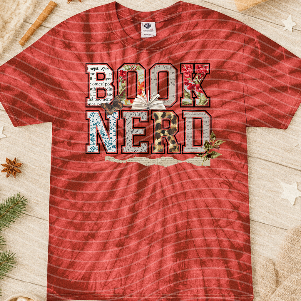 Graphic tee featuring "Book Nerd" design from Anchored Grace Boutique, with a casual fit and literary-themed artwork.