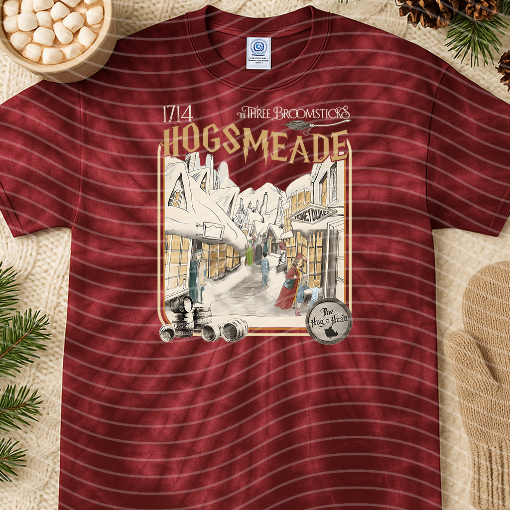Black Hogsmeade graphic tee from Anchored Grace Boutique featuring a detailed printed design on soft cotton fabric.