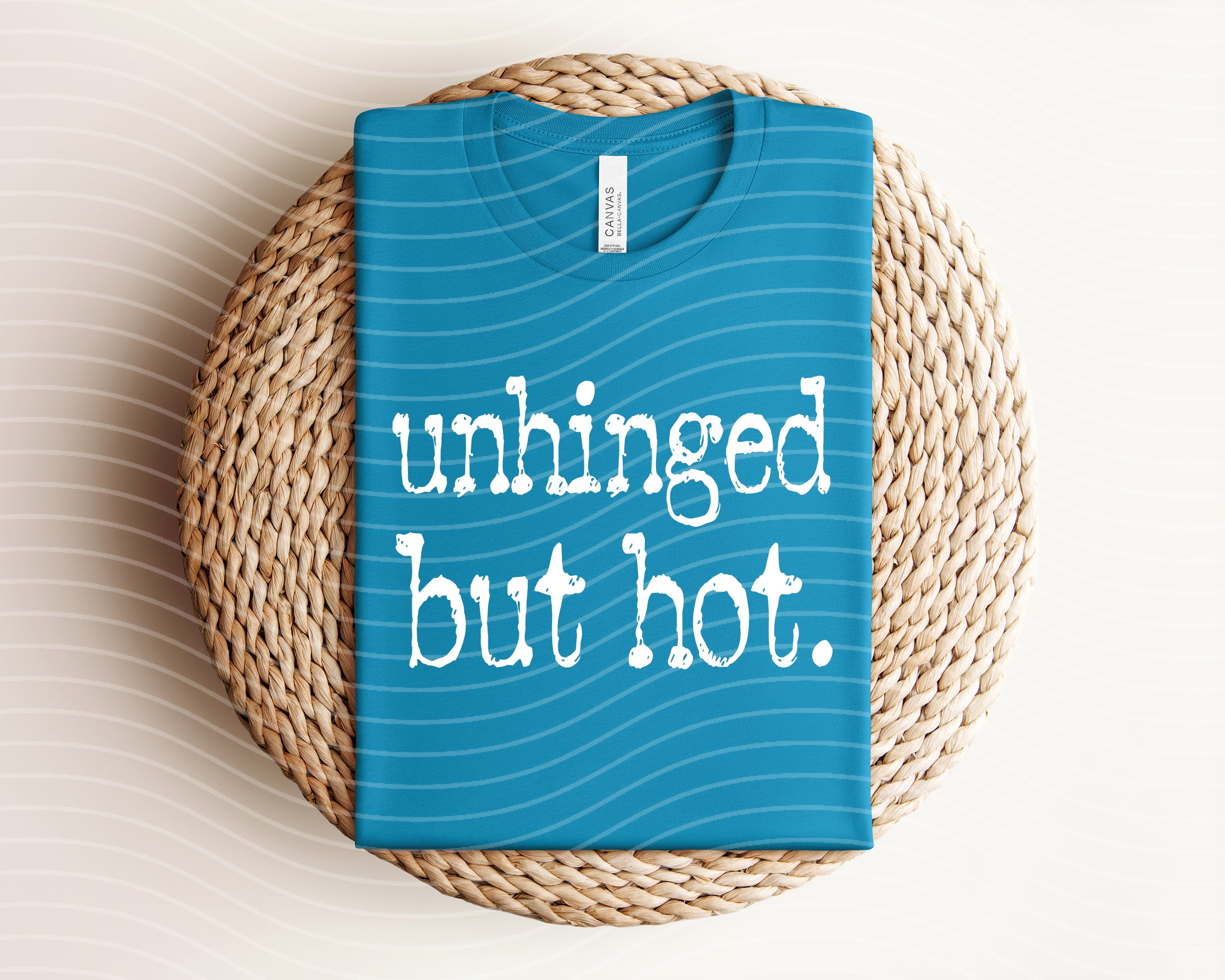 Black unhinged but hot graphic tee from Anchored Grace Boutique featuring bold white text and casual fit.