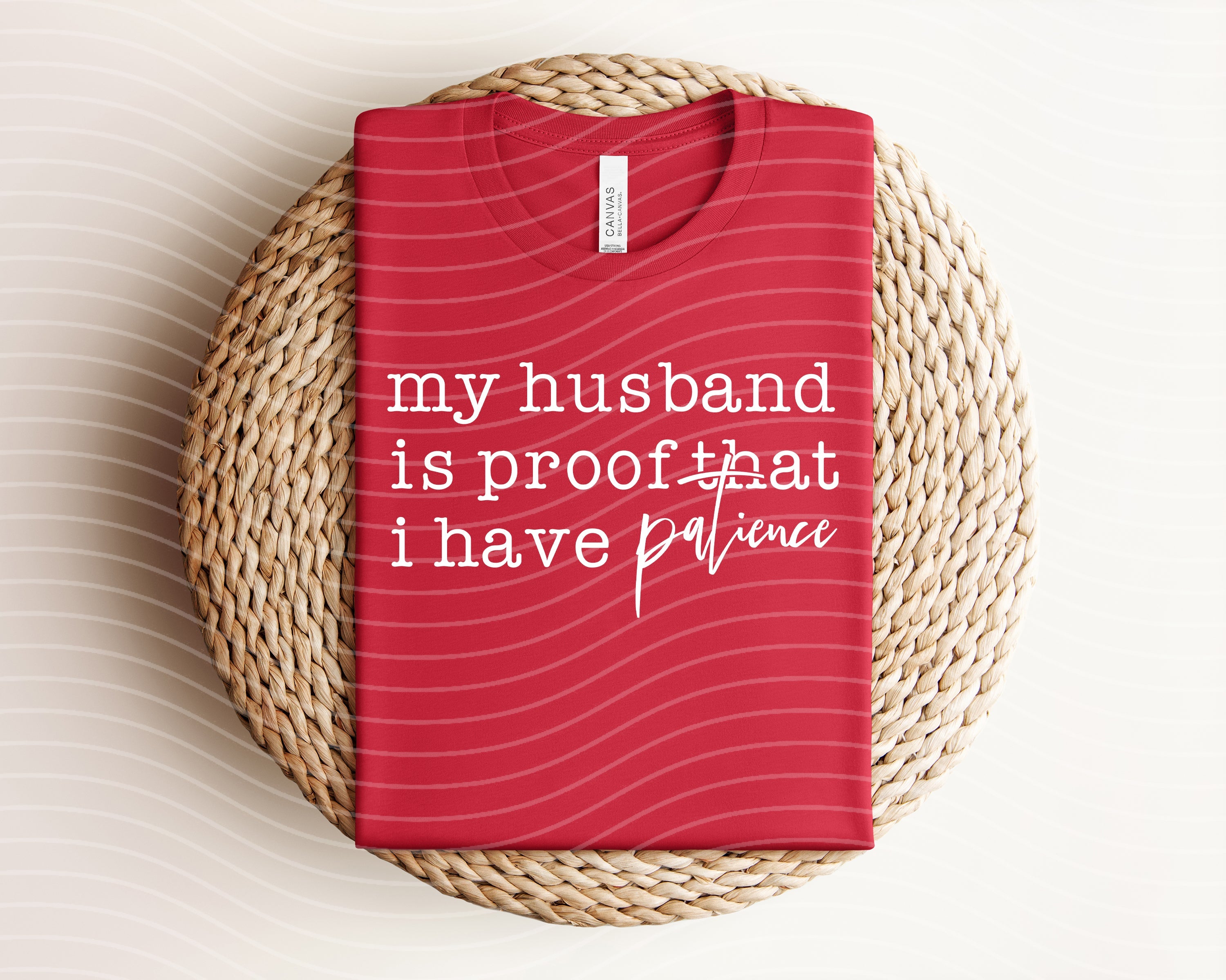 Gray graphic tee from Anchored Grace Boutique featuring the phrase "My Husband is Proof That I Have Patience" in stylish font.