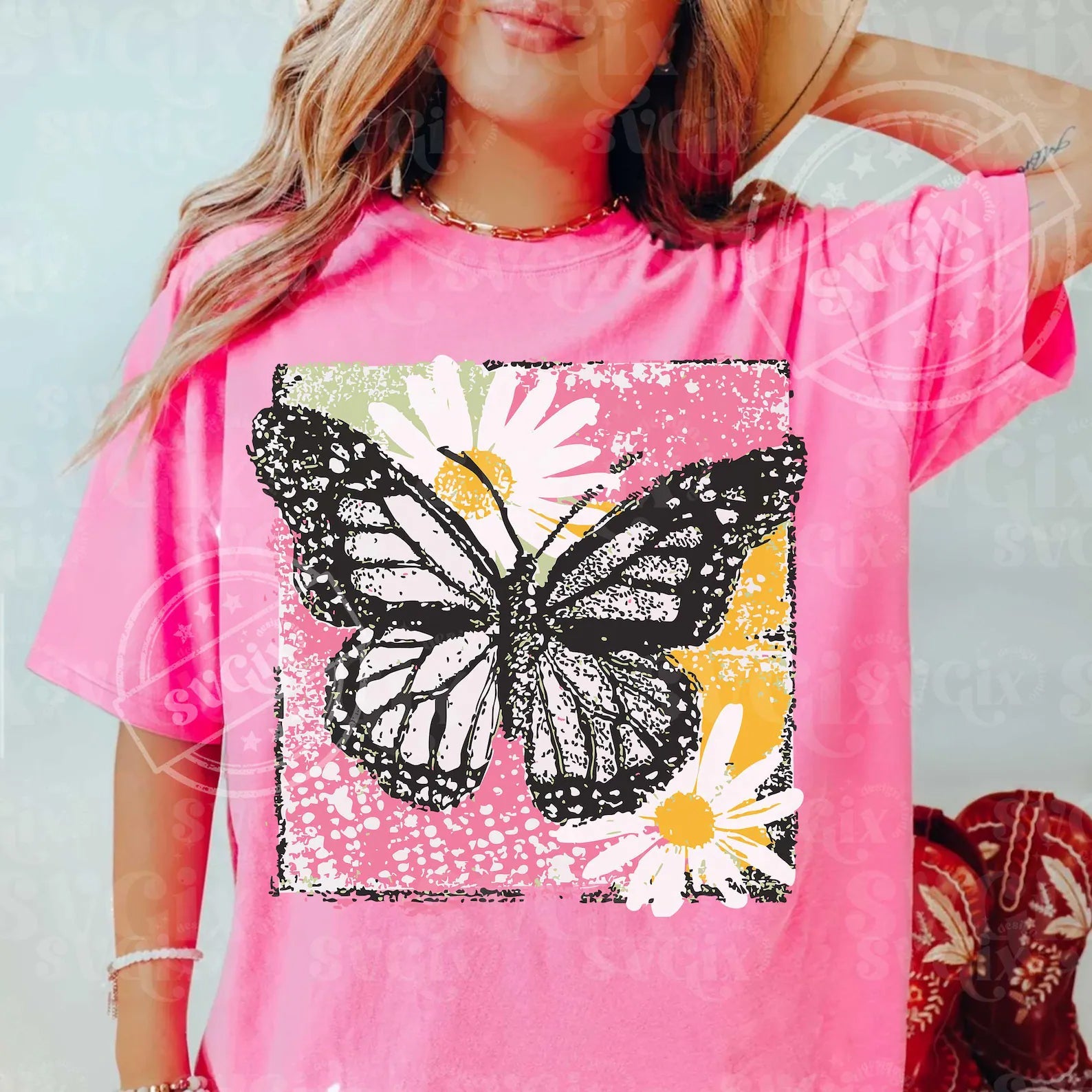 Painted butterfly graphic tee from Anchored Grace Boutique featuring vibrant butterfly artwork on a casual graphic tee.