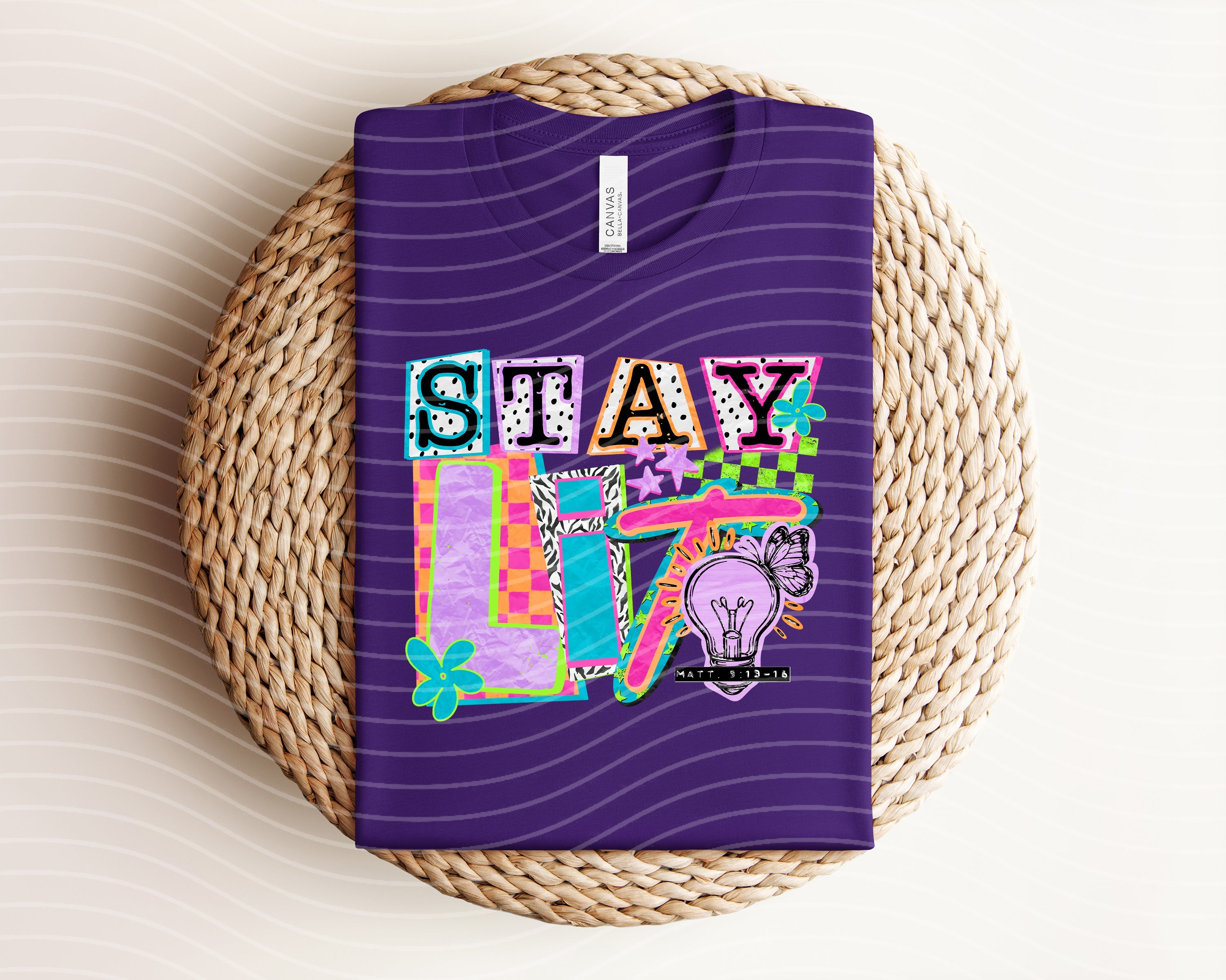 Stay Lit graphic tee from Anchored Grace Boutique featuring bold text and vibrant design on a casual cotton t-shirt.