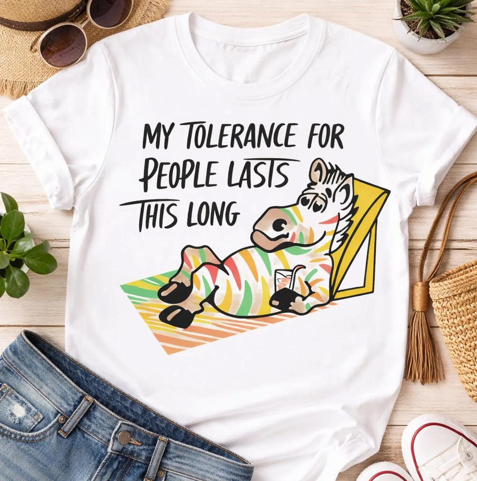 Black graphic tee by Anchored Grace Boutique with humorous "My Tolerance for People Lasts This Long" design, casual and comfortable fit.