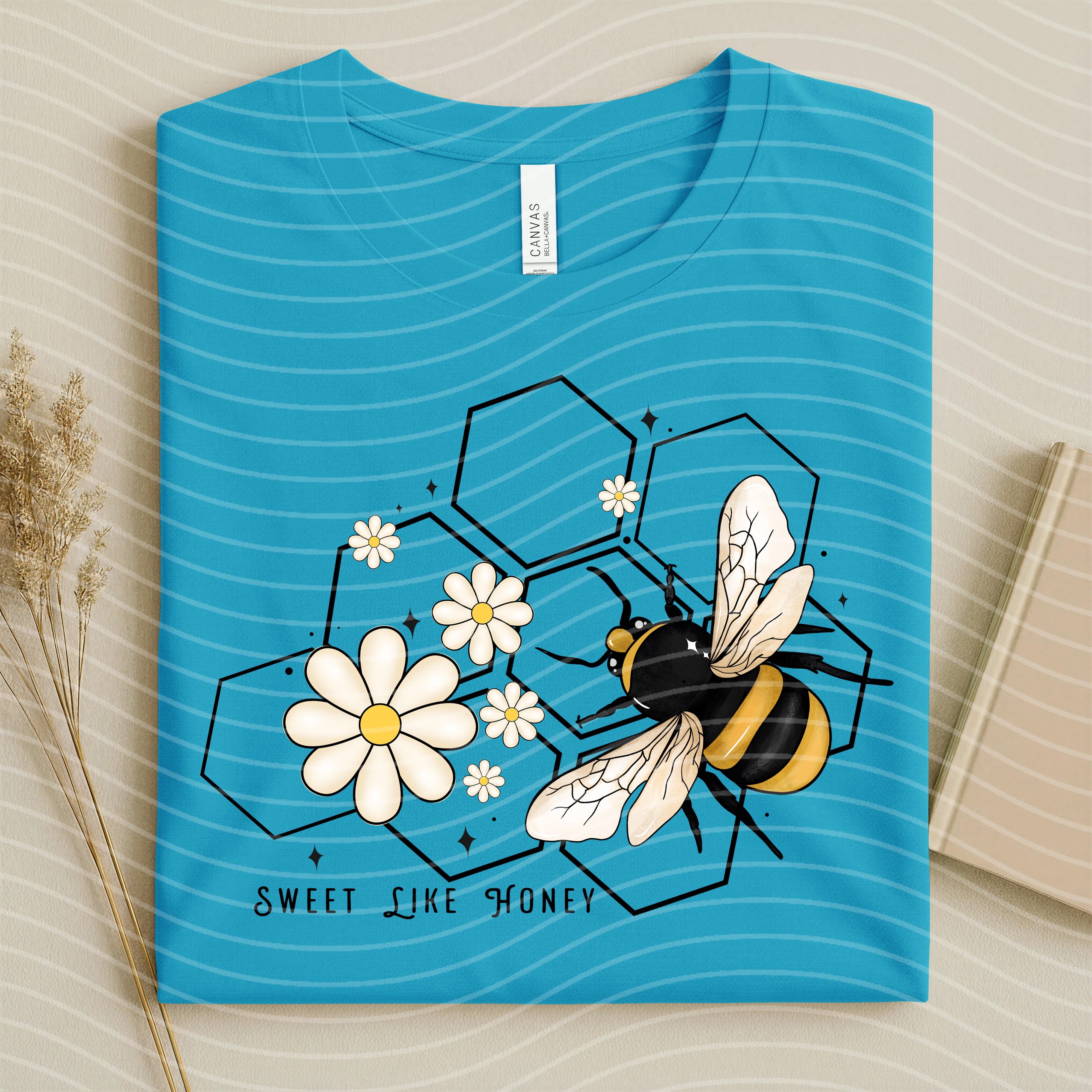 Sweet Like Honey graphic tee by Anchored Grace Boutique, featuring a stylish design on a comfortable cotton shirt.
