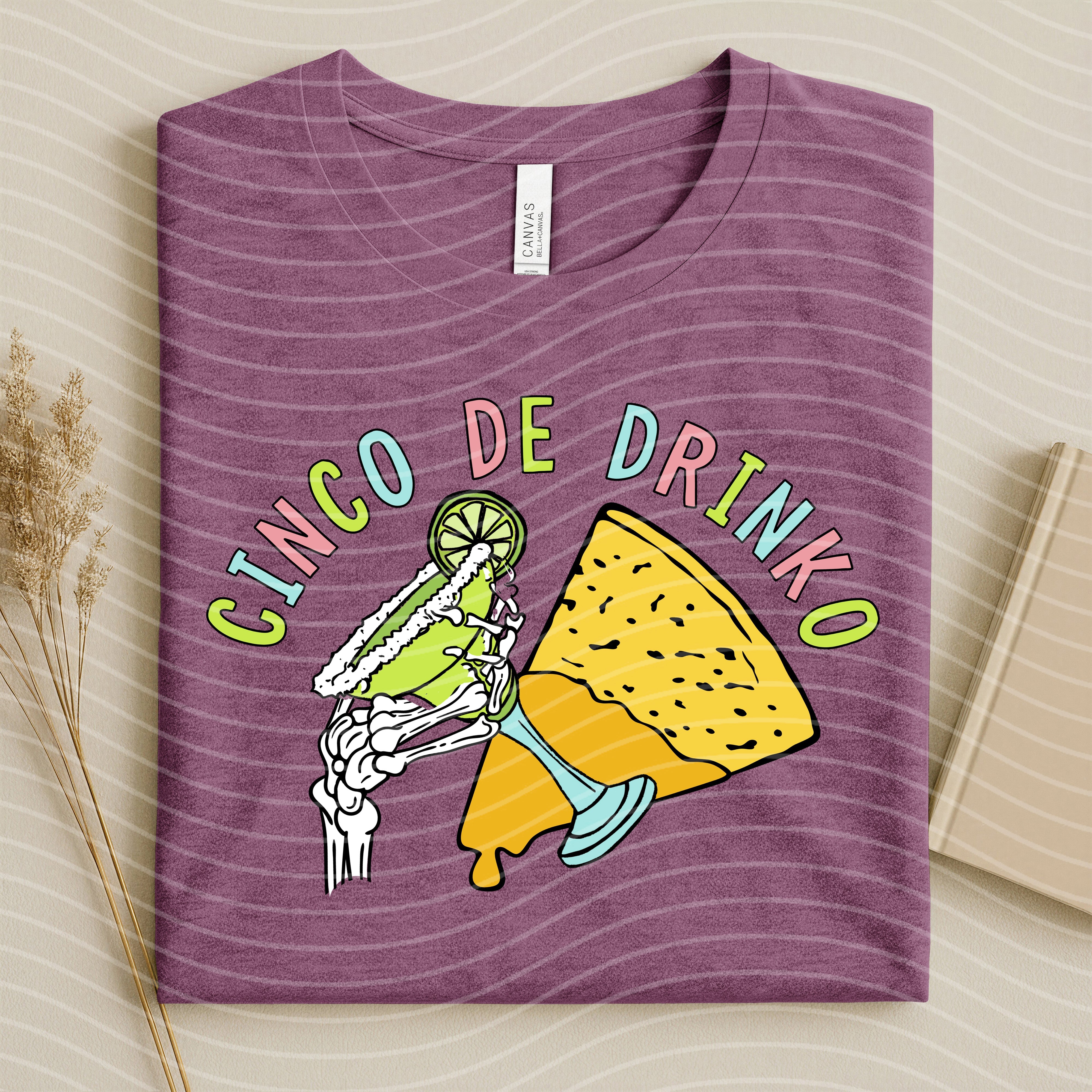 Cinco de Drinko graphic tee by Anchored Grace Boutique featuring colorful festive design and casual fit.