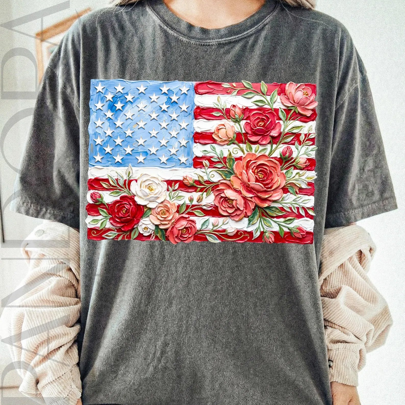 Painted floral flag graphic tee by Anchored Grace Boutique featuring vibrant floral and flag design on a casual graphic tee.