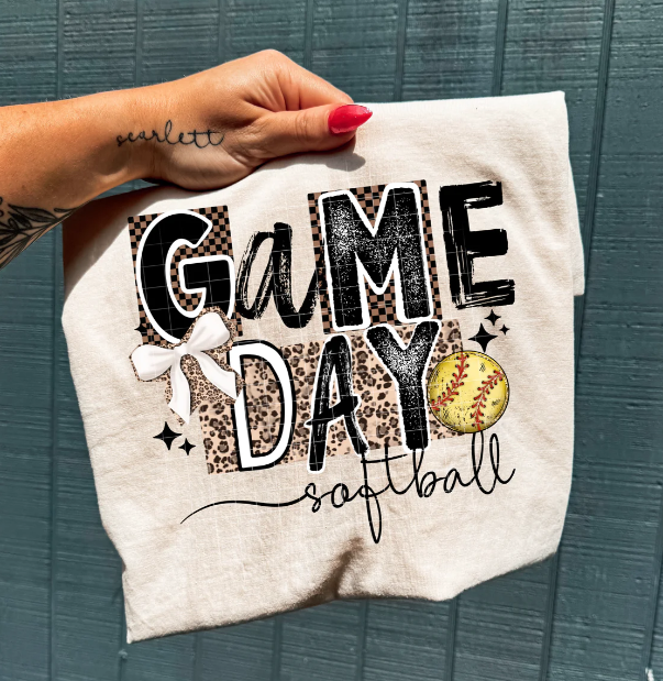 Softball graphic tee from Anchored Grace Boutique featuring game day design, casual cotton shirt for sports fans.