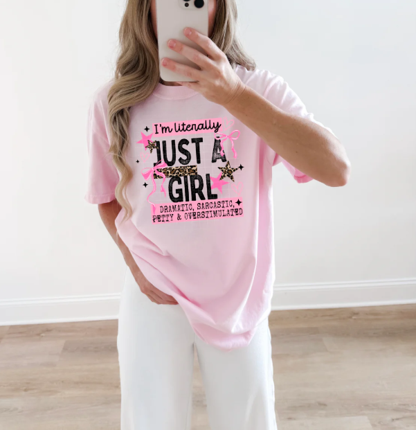 Black graphic T-shirt for women with "I'm Literally Just a Girl" text, from Anchored Grace Boutique.