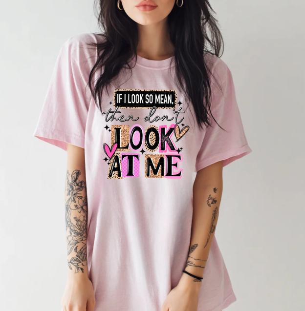 Black graphic tee by Anchored Grace Boutique with bold white text reading "If I Look So Mean Then Don't Look at Me" on the front.