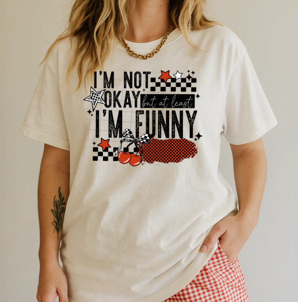 Black graphic tee by Anchored Grace Boutique featuring "I'm Not Okay" text in bold white lettering on the front.