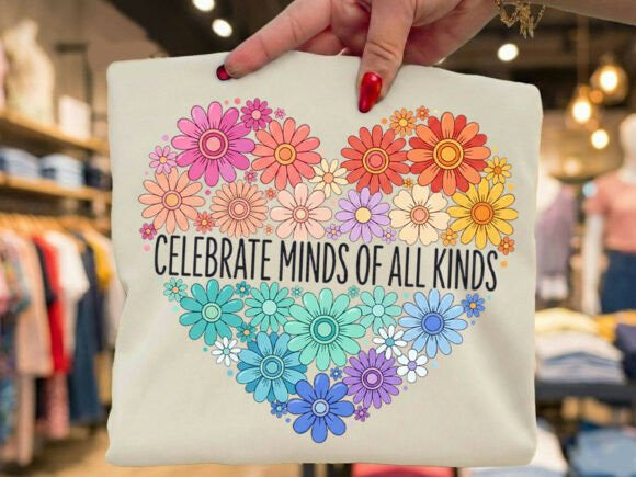 Celebrate Minds of All Kinds graphic tee by Anchored Grace Boutique, featuring a colorful, artistic design on a casual t-shirt.