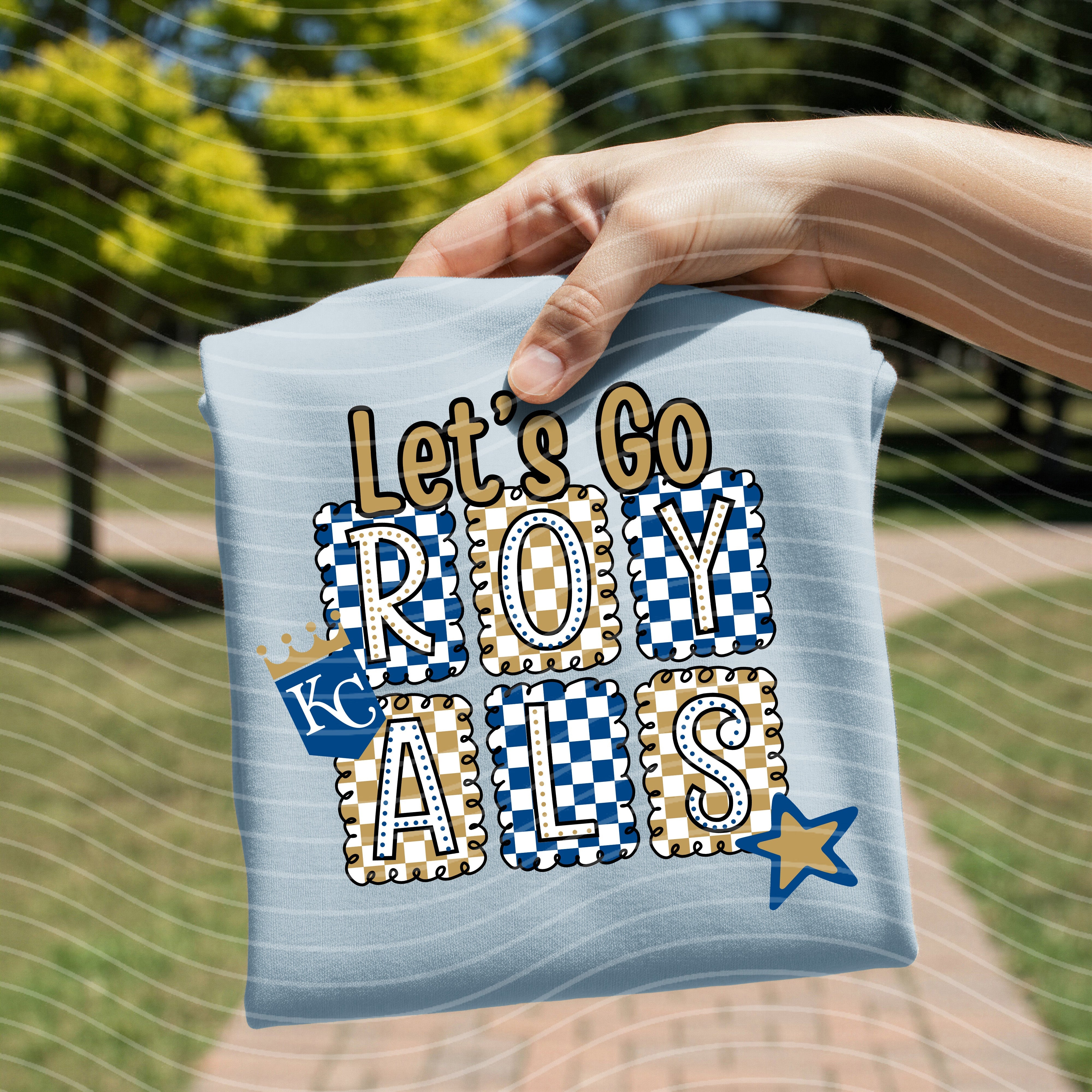 Let's Go Royals graphic tee by Anchored Grace Boutique, featuring bold team logo and vibrant design on a casual cotton t-shirt.