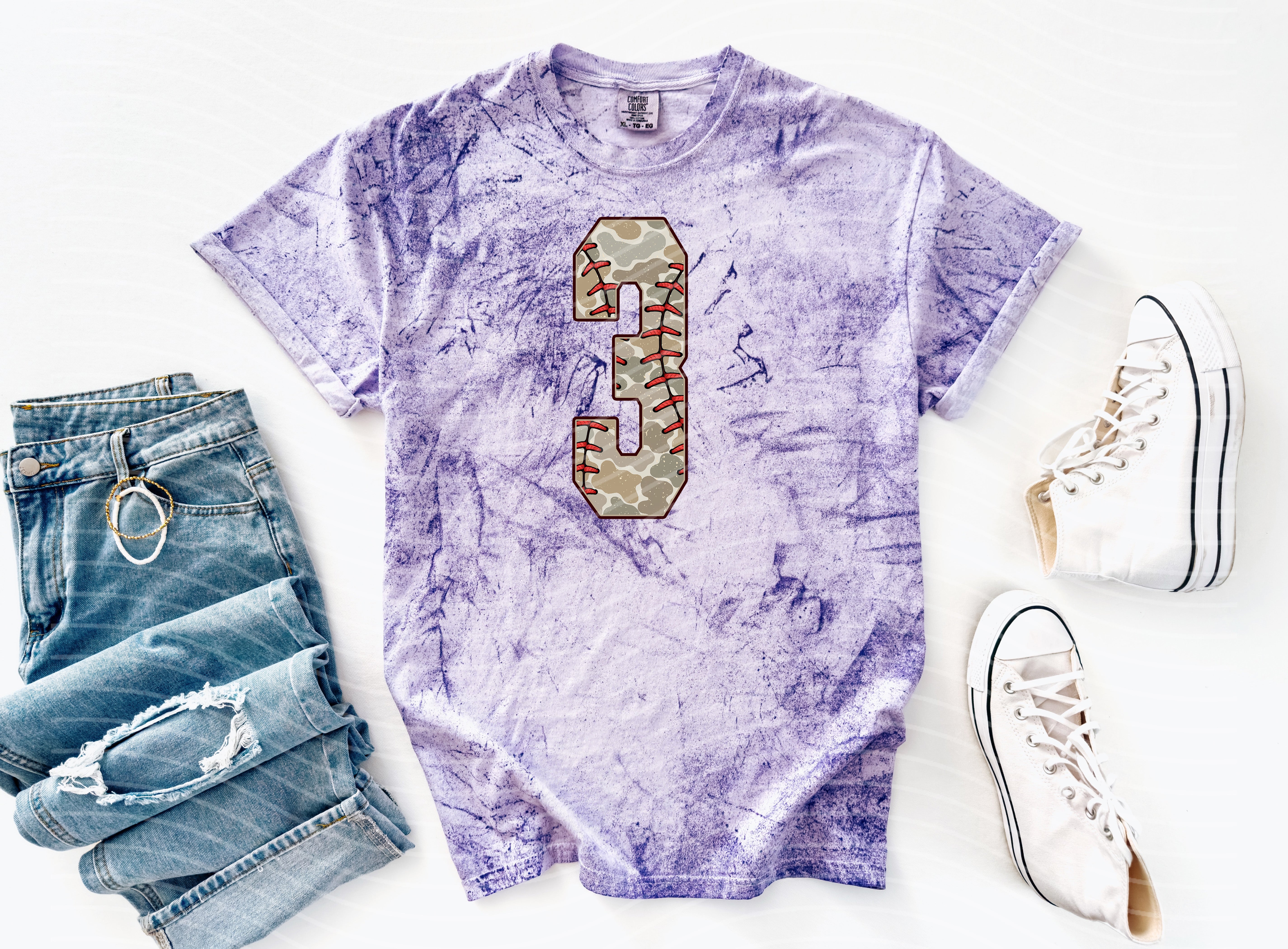 Camo baseball graphic tee with bold numbers, featuring a casual style from Anchored Grace Boutique.