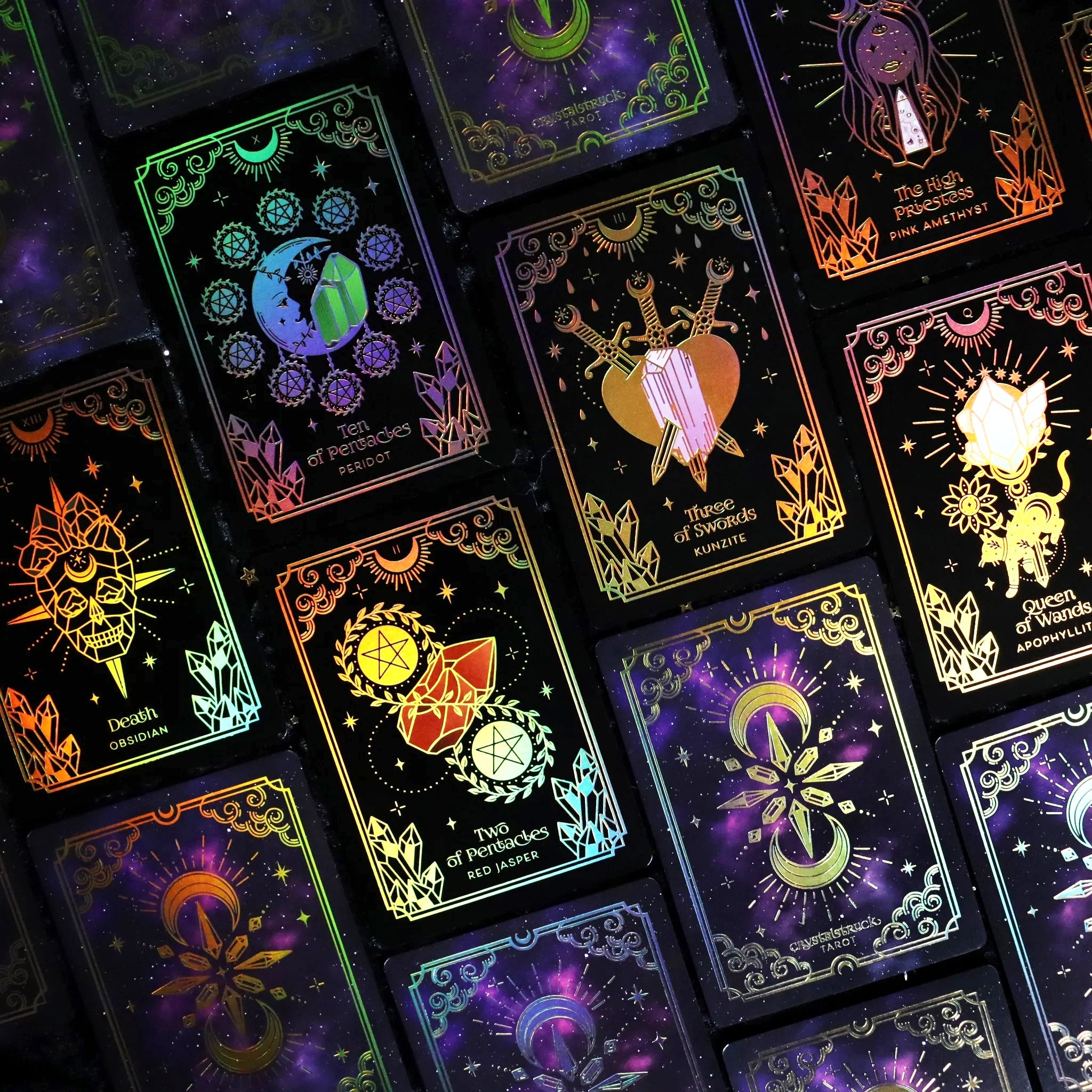 Mini Gold Crystalstruck Tarot© Card Deck by Moonstruck Crystals, featuring a close-up of the deck with intricate gold and crystal designs.