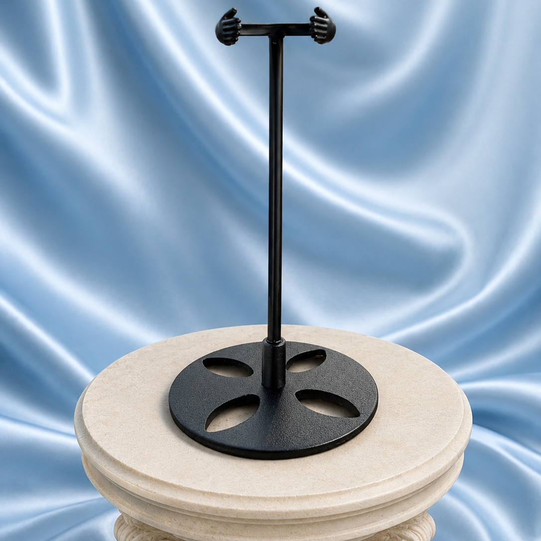 Elegant wand stand from 1 Practical Magic Store holding a magic wand, made of dark wood with intricate carvings.
