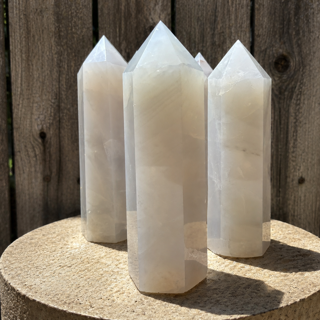 Blue silver rose quartz tower from 1 Practical Magic Store, showcasing polished crystal points for decorative and metaphysical use.