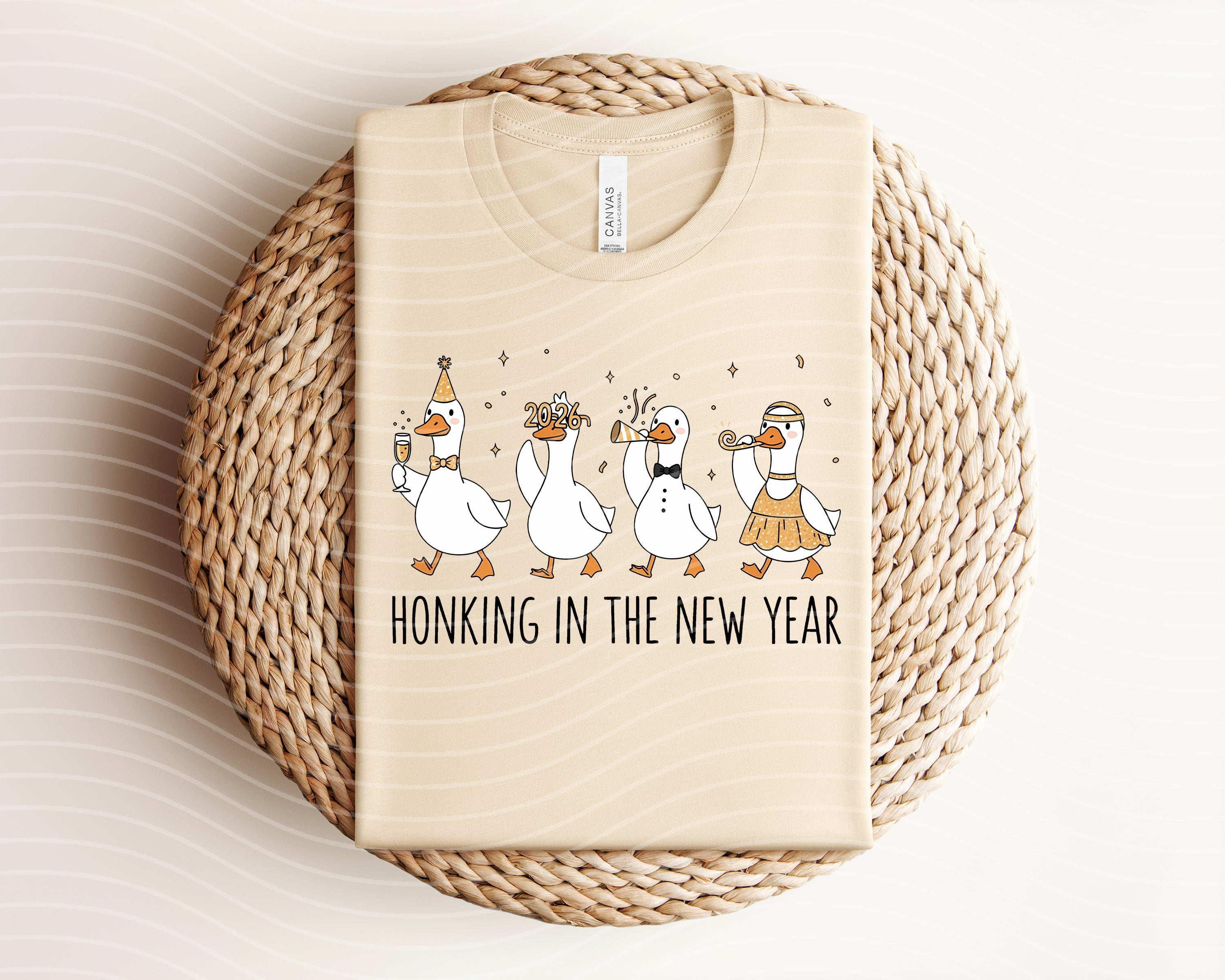Honking in the New Year graphic tee by Anchored Grace Boutique, featuring festive New Year-themed design on a casual t-shirt.