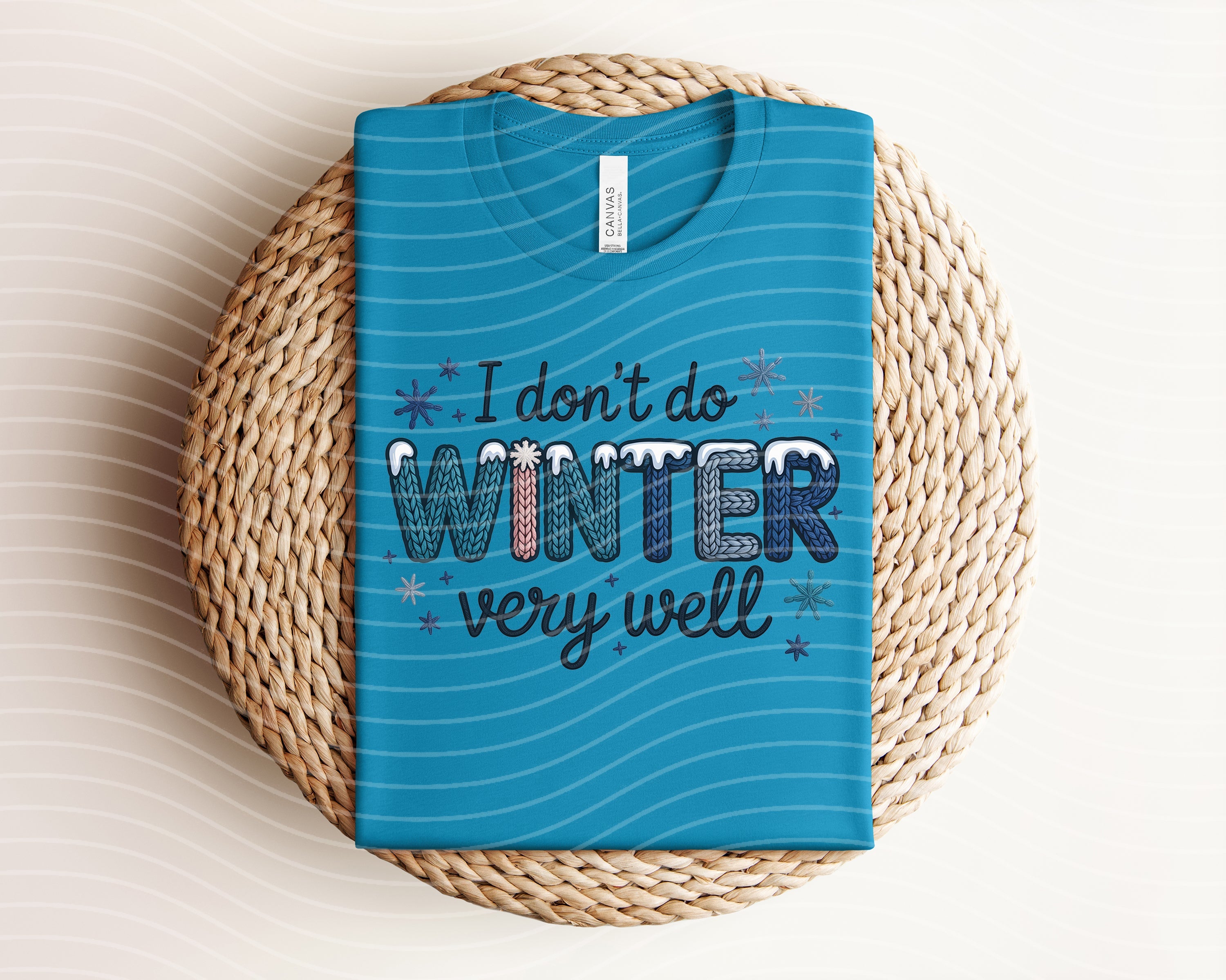 Graphic tee featuring "I Don't Do Winter Very Well" design by Anchored Grace Boutique, casual style, white fabric with printed text.