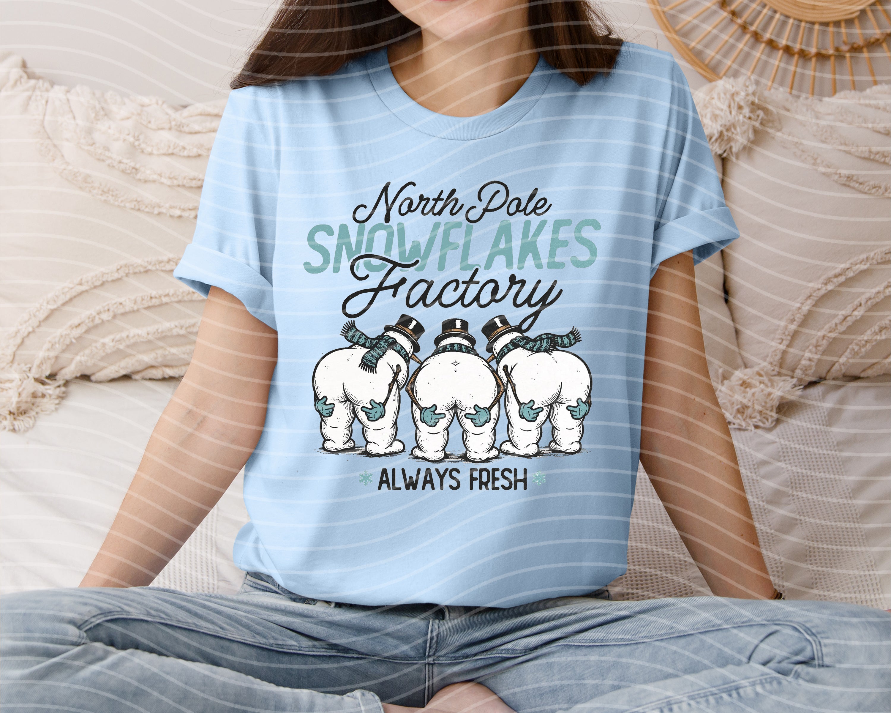 North Pole Snowflakes Factory graphic tee by Anchored Grace Boutique, featuring festive snowflake design on a casual t-shirt.