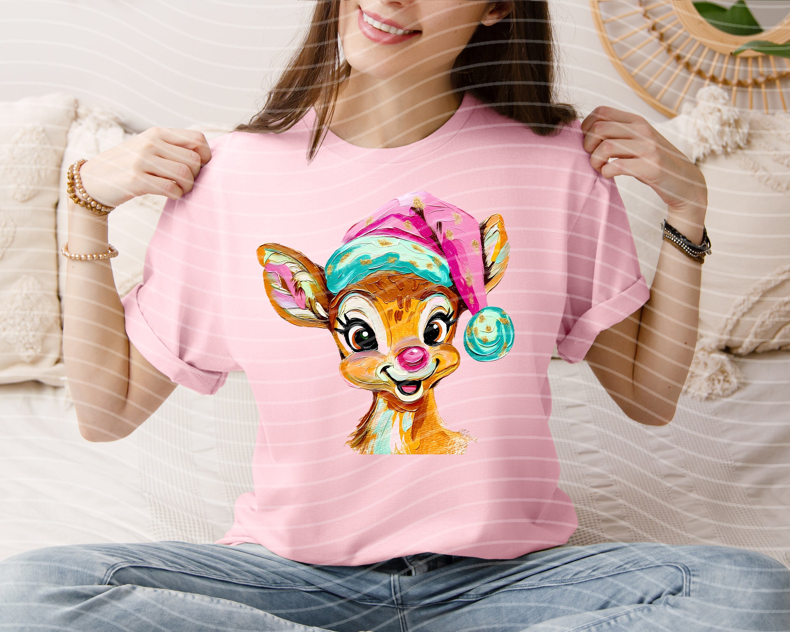 Painted reindeer graphic tee from Anchored Grace Boutique featuring festive holiday design on soft cotton fabric.