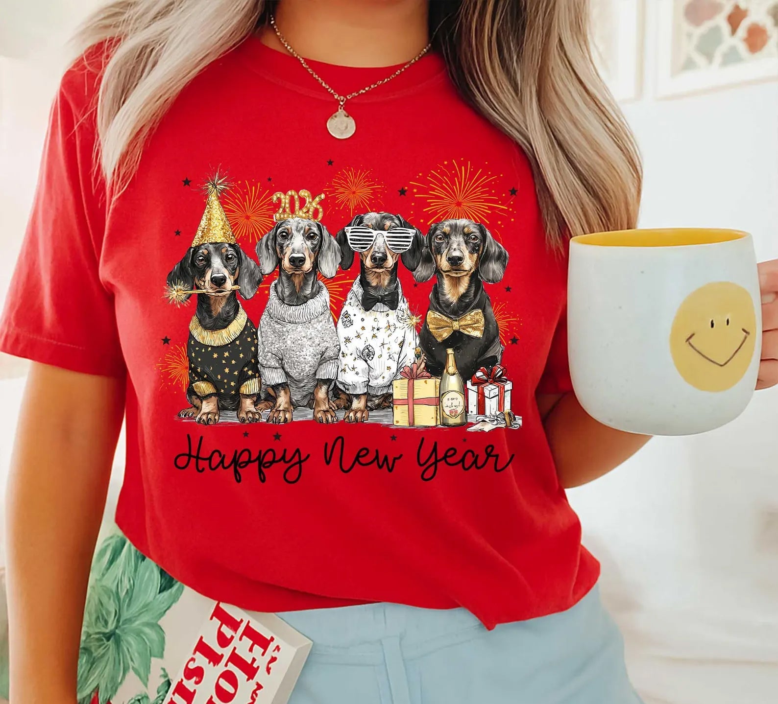 New Year Dogs graphic tee by Anchored Grace Boutique featuring a festive dog design on a casual shirt.