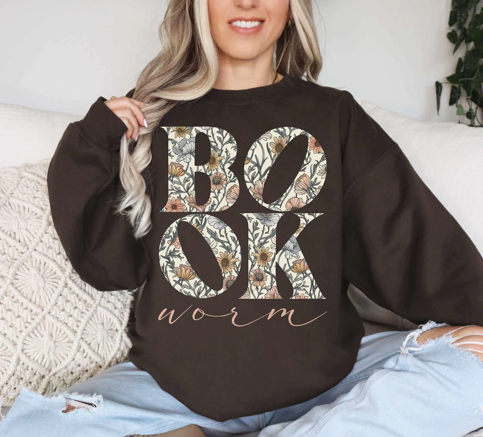 Black Book Worm graphic tee from Anchored Grace Boutique featuring a colorful worm illustration on soft cotton fabric.