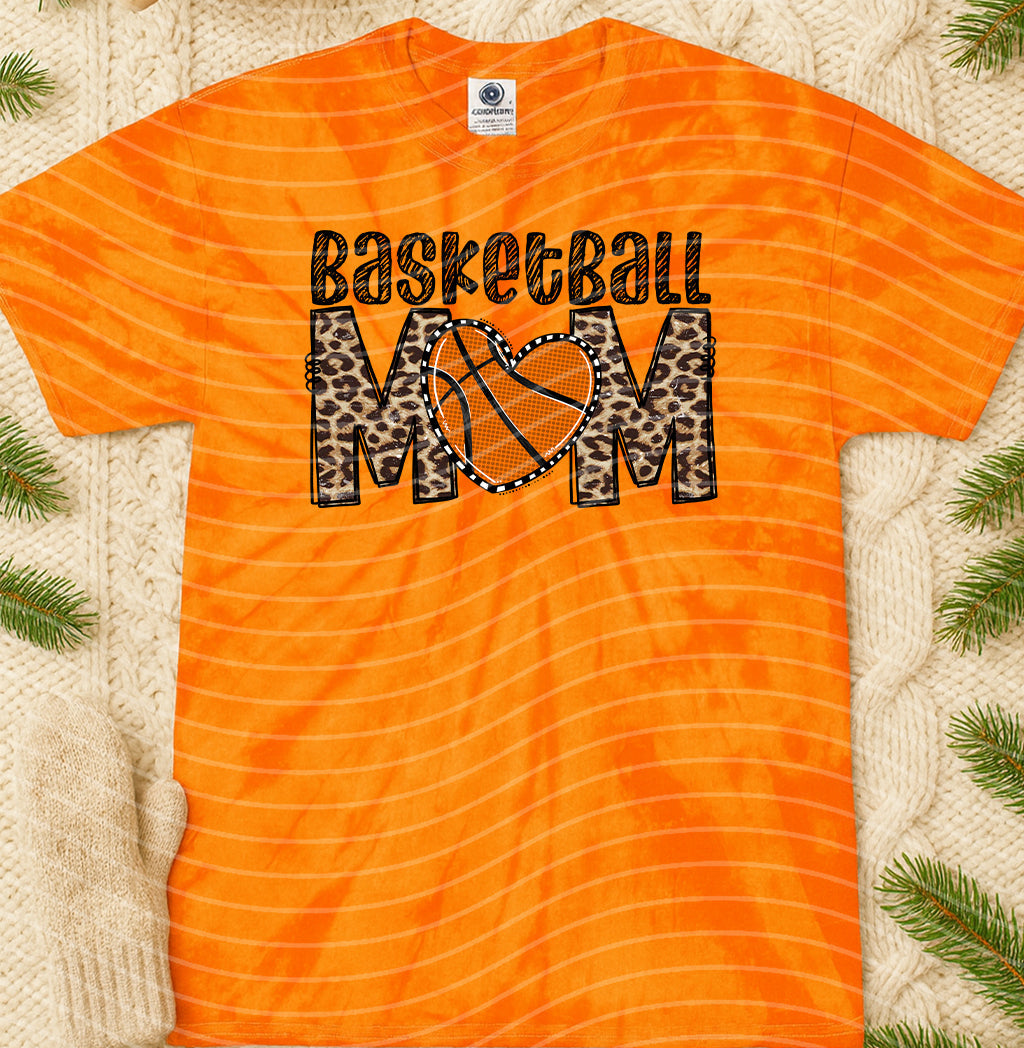 Basketball Mom graphic tee by Anchored Grace Boutique featuring a stylish design on a casual cotton t-shirt.