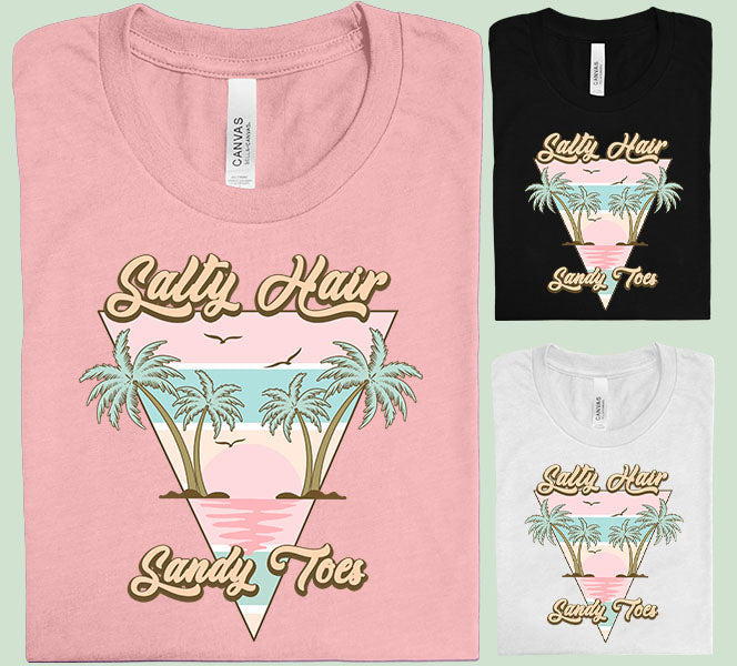 Salty Hair Sandy Toes graphic tee by Anchored Grace Boutique featuring beach-themed design and casual fit.