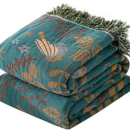 CozyNest Decor boho-style fall throw blanket with bird and flower patterns, perfect for beds, couches, and vintage decor.