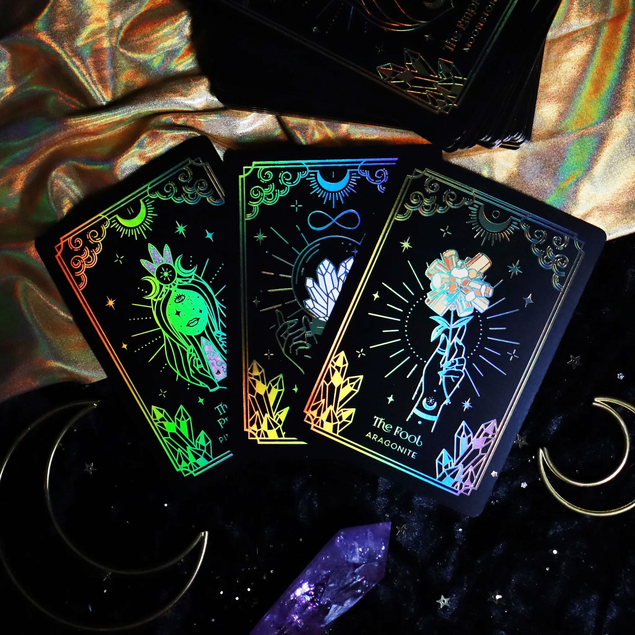 Mini Gold Crystalstruck Tarot© Card Deck by Moonstruck Crystals, featuring intricately designed tarot cards with gold accents.