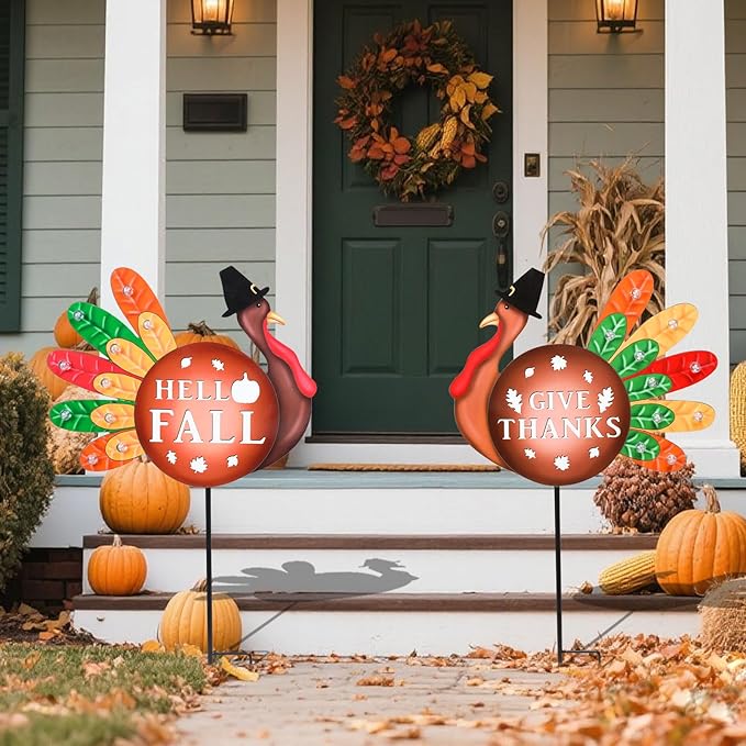 Two CozyNest Decor metal fall yard signs with LED lights featuring turkeys and harvest themes for garden and lawn decor.