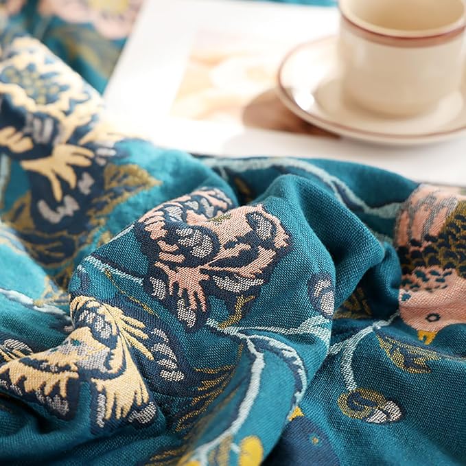 CozyNest Decor boho muslin twin-size cotton blanket with floral teal design, soft and breathable for sofa or bed use.