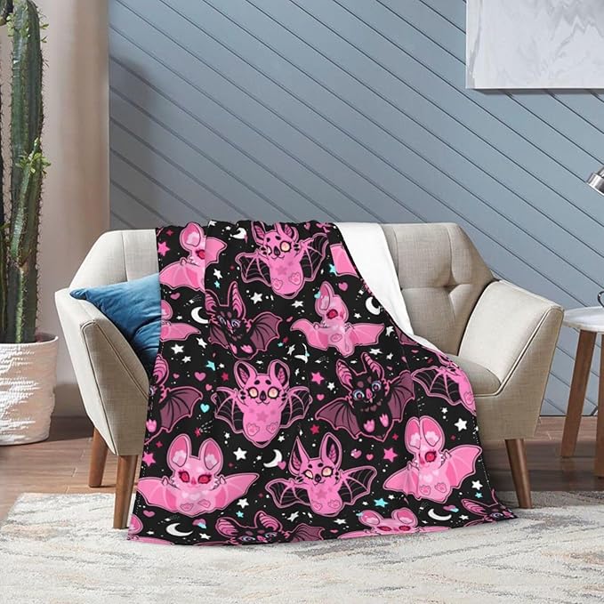 Pink CozyNest Decor fleece throw blanket for kids and adults, soft and cozy for couch, bed, or sofa decor.