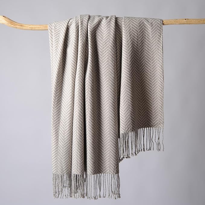 CozyNest Decor Cuddle Dreams silk throw blanket with hand-knotted fringe in herringbone gray, soft, breathable, and natural fabric.