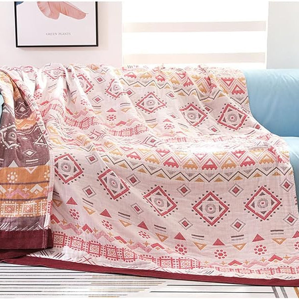 CozyNest Decor boho muslin bed blanket, 80x90 inches, soft 4-layer gauze cotton with red geometric farmhouse design for sofa or bed.