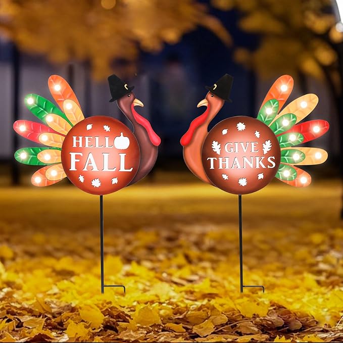 Two CozyNest Decor metal fall yard signs with LED lights featuring turkey and "Give Thanks" for Thanksgiving garden decor.