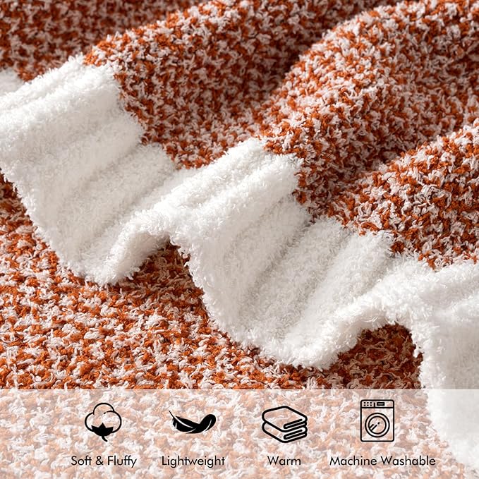 CozyNest Decor MIULEE burnt orange throw blanket on a sofa, showcasing its soft, fluffy knit fabric and warm, inviting texture.