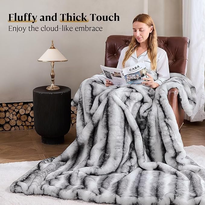 Black and white plush faux fur blanket for bed or sofa, cozy and reversible, soft thick throw from CozyNest Decor, 70x90 inches.